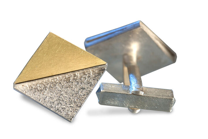 Manschettenknöpfe in Silber und Gold